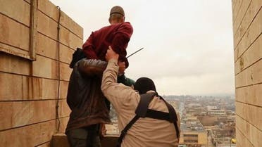 In December, IS posted photographs showing jihadists throwing a man off a rooftop and then stoning him to death because he was gay. (Via YouTube)