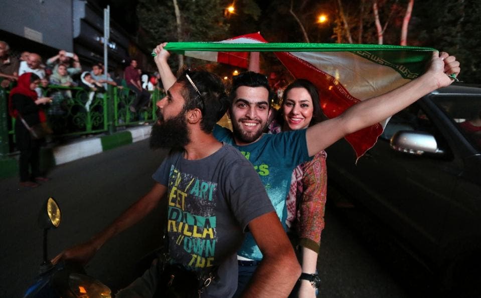 Many Iranians celebrated in the streets after Tehran's nuclear negotiating team struck a deal with world powers in Vienna last month (AFP Photo/Atta Kenare)