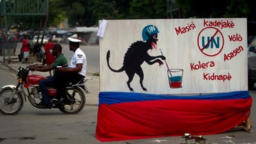 A free-standing mural depicting a U.N. peacekeeper as an animal is displayed in the median of a downtown street of Port-au-Prince, Haiti, Thursday Sept. 8, 2011. (AP)