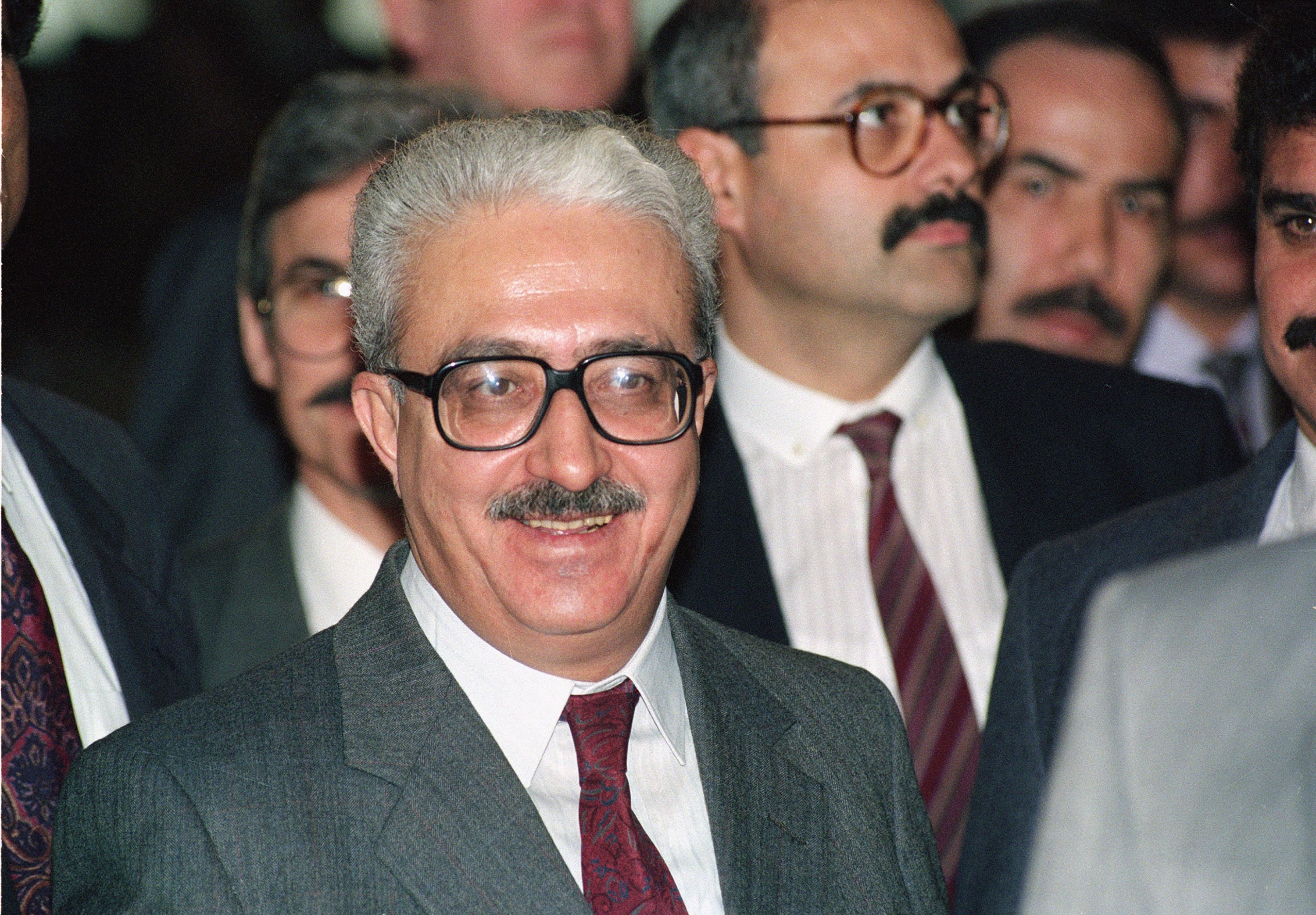 Iraqi Foreign Minister Tariq Aziz leaves the conference room after his initial meeting with U.S. Secretary of State James A. Baker in Geneva, Switzerland, Jan. 9, 1991. The meeting took place after the U.N. Security Council passed a resolution presenting the Iraqis with an ultimatum to withdraw its troops from Kuwait by Jan. 15. (File photo: AP)