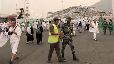 Saudi security forces patrol while Muslim pilgrims gather at the Plain of Arafat during hajj, near Mecca, Saudi Arabia, October 2, 2014. (AP)
