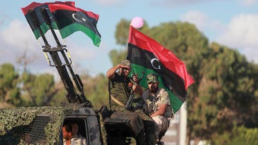Members of the Libyan army give protection to a demonstration in support of the Libyan army under the leadership of General Khalifa Haftar, in Benghazi, Libya, August 14, 2015. REUTERS