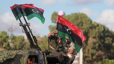 Members of the Libyan army give protection to a demonstration in support of the Libyan army under the leadership of General Khalifa Haftar, in Benghazi, Libya, August 14, 2015. REUTERS