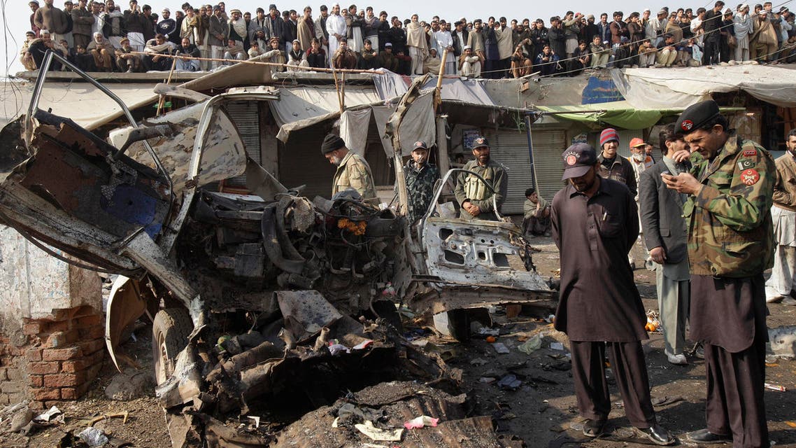 Pakistani security personnel inspect the site of explosion in Pakistani tribal area of Khyber near Peshawar, Pakistan on Tuesday, Jan 10, 2012. (File photo: AP)