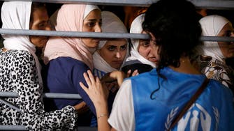 Syrian refugees register on ship sent by Greece
