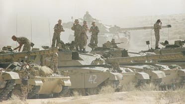 Tank crews with the British 7th Armoured Brigade stand atop their Challenger tanks after a simulated battle in the dusty eastern Saudi Arabian desert, Saturday, Dec. 1, 1990 in Saudi Arabia. (AP)