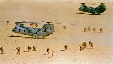 U.S. Marines deploy from CH-46 helicopters in the Saudi desert during the fourth day of Operation Imminent Thunder on Sunday, Nov. 18, 1990. Some 1,000 troops and 1,110 aircraft are participating in the mock seaborne invasion underway about 100 miles south of Kuwait. (AP)