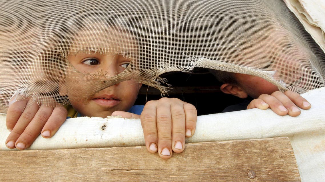 Syrian refugee children look out from their tent during a visit by United Nations (U.N.) Humanitarian Chief and Emergency Relief Coordinator Stephen O'Brien. (File: Reuters)