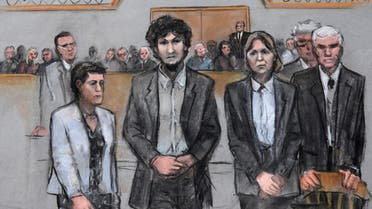 In this courtroom sketch, Boston Marathon bomber Dzhokhar Tsarnaev, center, stands with his defense attorneys as a death by lethal injection sentence is read at the Moakley Federal court house. (File: AP)