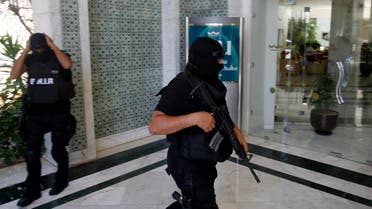 Tunisian police officers guard the Imperial Marhaba hotel during visit of top security officials of Britain, France, Germany and Belgium in Sousse, Tunisia, Monday, June 29, 2015. (Reuters)