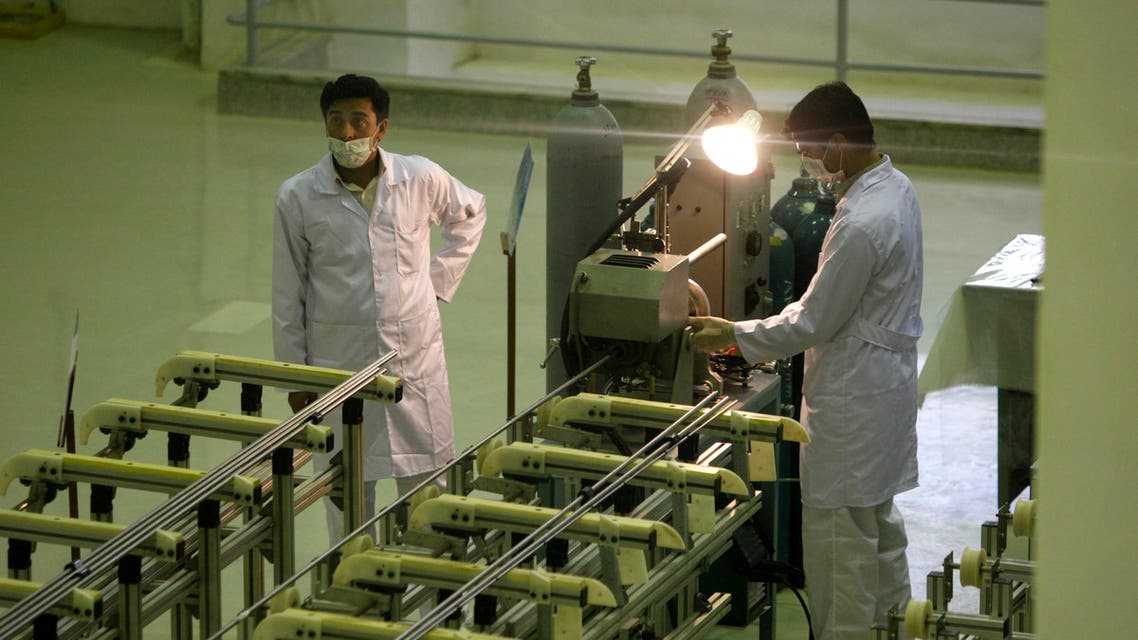 In this April 9, 2009 file picture Iranian technicians work at a new facility producing uranium fuel for a planned heavy-water nuclear reactor, just outside the city of Isfahan, 255 miles (410 kilometers) south of the capital Tehran. AP