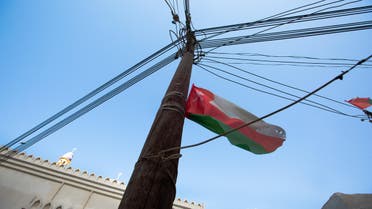 The Oman flag flies on an electricity pole in the middle of the village. (Amanda Fisher/Al Arabiya News)