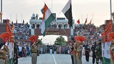 ndian and Pakistani flags are lowered during a daily retreat ceremony at the India-Pakistan joint border check post of Attari-Wagah near Amritsar, India, Tuesday, July 21, 2015.