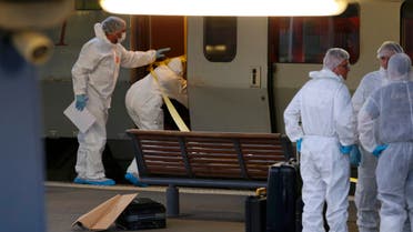 French investigating police in protective clothing prepare to enter the Thalys high-speed train where shots were fired to collect clues in Arras, France, August 21, 2015. (Reuters)