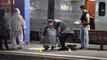  Police work on a platform next to a Thalys train of French national railway operator SNCF at the main train station in Arras, northern France, on August 21, 2015. (AFP)