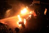 A police motorcycle burns as Lebanese protestors are sprayed by riot police using water cannons, during a protest against the ongoing trash crisis, in downtown Beirut, Lebanon, Sunday, Aug. 23, 2015. AP 