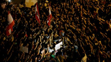 Lebanese activists chant slogans during an anti-government protest in front the main Lebanese government building, downtown Beirut, Lebanon. (AP)