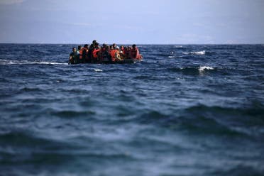 Syrian refugees on a dinghy approach, in rough seas, a beach on the island of Lesbos, Greece August 23, 2015. (Reuters)