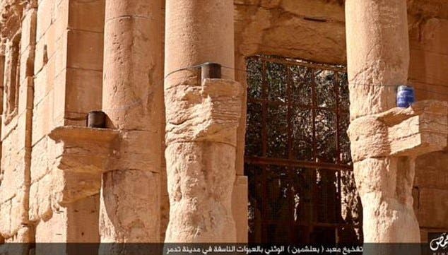 Smoke rises from the Baalshamin temple after ISIS militants filled it with explosives and detonated them in the ancient wonder. (Twitter)