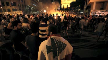 Protesters gather near a fire during a protest against corruption and against the government's failure to resolve a crisis over rubbish disposal, in front of the government palace in Beirut. (Reuters)