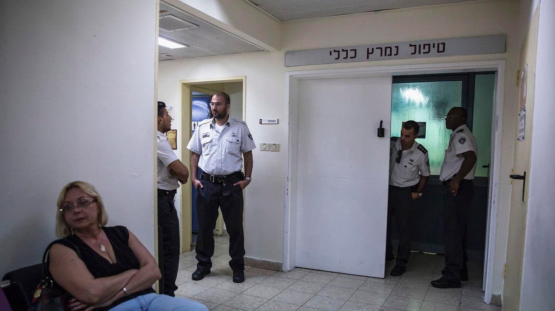 eli Prisons Service guards secure the entrance to the intensive care unit were Mohammed Allan, a Palestinian prisoner on hunger strike is held in Barzilai hospital. (File photo: AP)