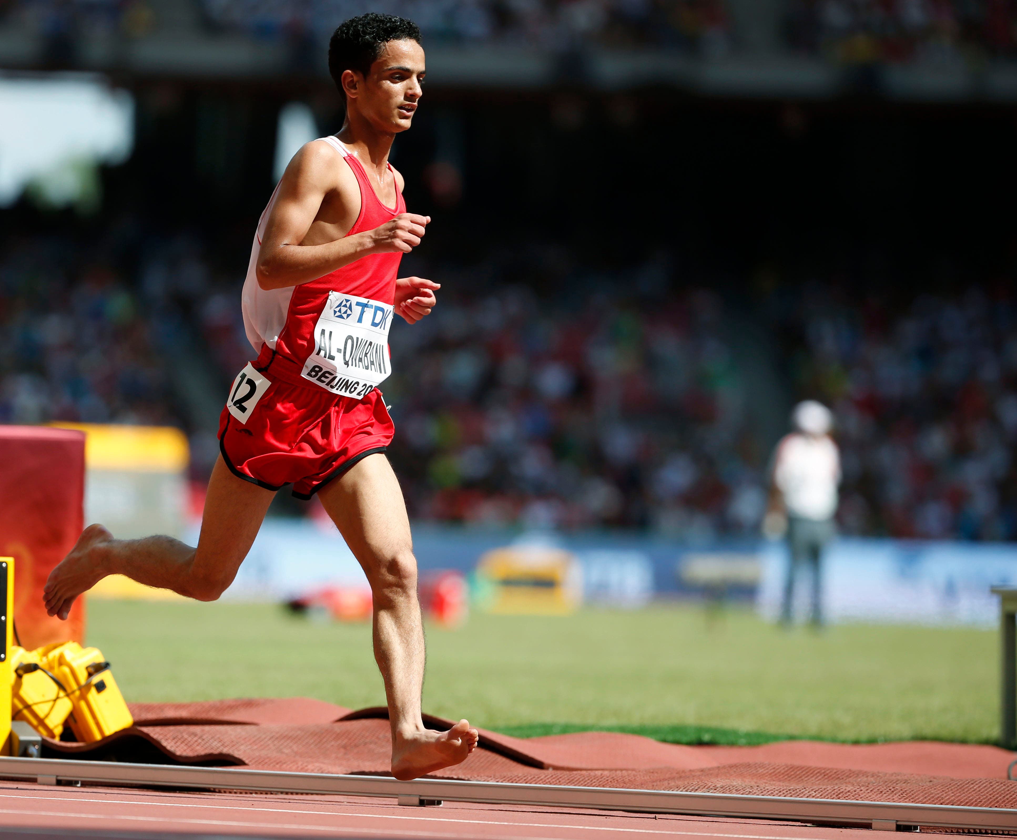Qwabani of Yemen competes barefoot in his men's 5000 metres heat at the IAAF World Championships at the National Stadium in Beijing, China August 26, 2015.   (AP)