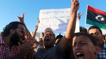 People take part in a demonstration to show support for the Libyan army under the leadership of General Khalifa Haftar, in Benghazi