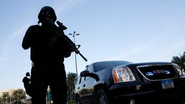 A police officer stands guard near the hotel where the 10th International Institute for the strategic Studies taking place in Manama, Bahrain, Dec. 5, 2014. (AP)