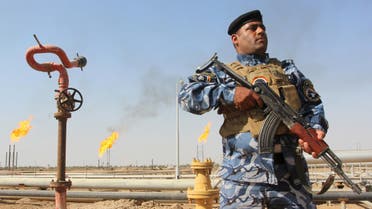 A member of the oil police force stands guard at Nahr Bin Umar oil field, north of Basra, southeast of Baghdad August 19, 2015. Iraq's oil exports have fallen by at least 250,000 barrels per day (bpd) so far in August according to loading data, making it less likely the several-month trend of rising OPEC output that has weakened oil prices will be sustained this month. REUTERS/Essam Al-Sudani