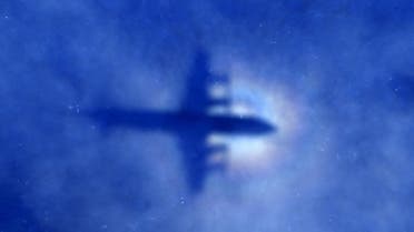 The shadow of a Royal New Zealand Air Force (RNZAF) P3 Orion maritime search aircraft can be seen on low-level clouds as it flies over the southern Indian Ocean looking for missing Malaysian Airlines flight MH370 in this March 31, 2014 file photo. Malaysia is "almost certain" that plane debris found on Reunion Island in the Indian Ocean is from a Boeing 777, the deputy transport minister said on July 30, 2015, heightening the possibility it could be wreckage from missing Flight MH370. REUTERS/Rob Griffith/Pool/Files