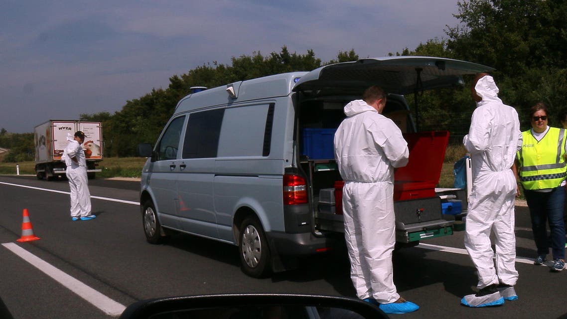 Police stand in fron of a truck parked on the shoulder of the highway A4 near Parndorf south of Vienna, Austria, Thursday, Aug 27, 2015. AP