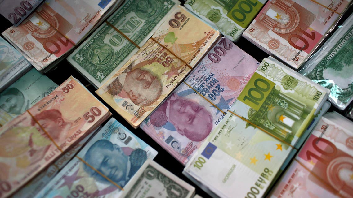  FILE - In this Monday, June 8, 2015 file photo, Turkish Liras, Euros and U.S. Dollars are stacked at a currency exchange office in Istanbul, Turkey. In emerging markets worldwide, currencies are plunging over fears that developing economies are on the verge of a crippling fall. The damage has spilled across oceans. The Dow Jones industrials plunged 328 points, nearly 2 percent, in early-afternoon trading Friday, Aug. 21, 2015 on top of a 358-point drop Thursday. (AP Photo/Emrah Gurel)