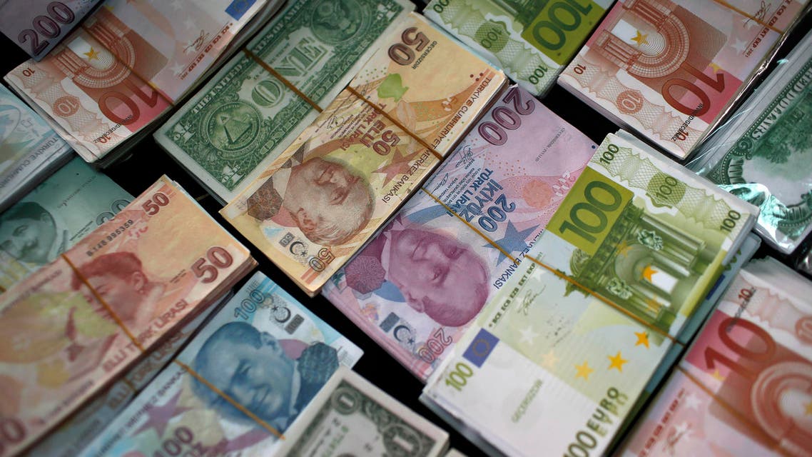 FILE - In this Monday, June 8, 2015 file photo, Turkish Liras, Euros and U.S. Dollars are stacked at a currency exchange office in Istanbul, Turkey. In emerging markets worldwide, currencies are plunging over fears that developing economies are on the verge of a crippling fall. The damage has spilled across oceans. The Dow Jones industrials plunged 328 points, nearly 2 percent, in early-afternoon trading Friday, Aug. 21, 2015 on top of a 358-point drop Thursday. (AP Photo/Emrah Gurel)