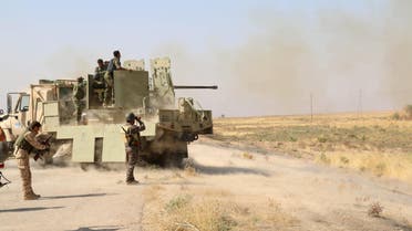 Kurdish Peshmerga fighters fire towards Islamic State militants south of Daquq, north of Baghdad August 26, 2015. (reuters)