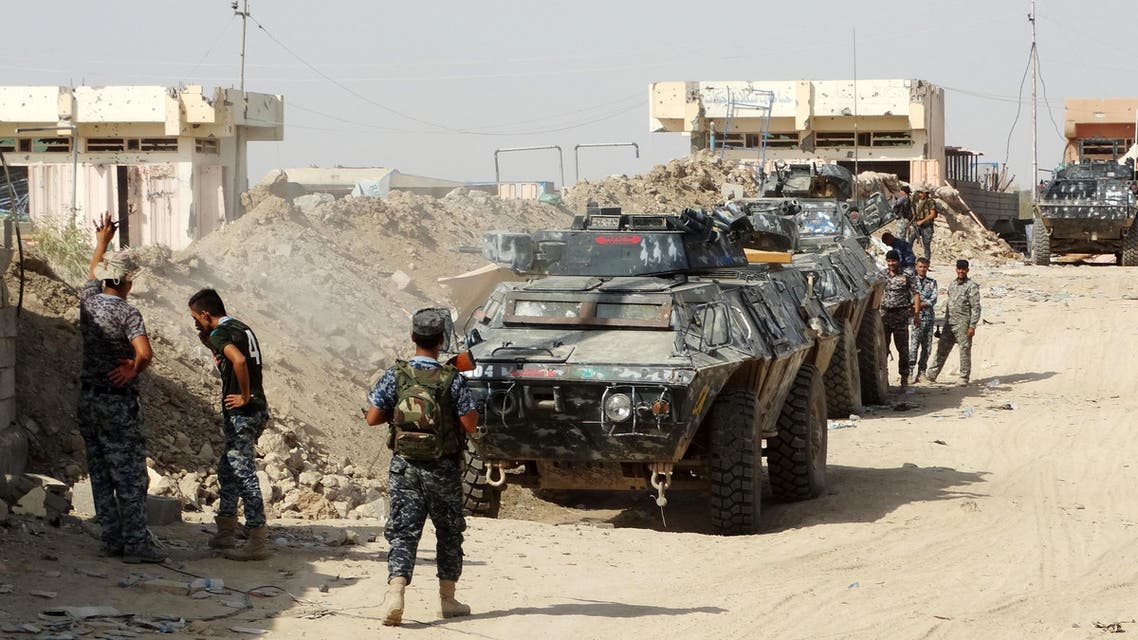 In this Thursday, Aug. 27, 2015 photo, Iraqi security forces, backed by Sunni and Shiite volunteers clash with Islamic State group militants at the front line in the eastern suburbs of Ramadi, Anbar province, Iraq. (AP)
