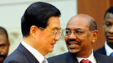  Chinese President Hu Jintao, left, and Sudan's President Omar al-Bashir arrive at the signing ceremony at the Great Hall of the People in Beijing Wednesday, June 29, 2011. China rolled out the red carpet Wednesday for a state visit by Sudan's president, who is wanted on an international warrant that accuses him of war crimes. (AP Photo/Liu Jin, Pool)