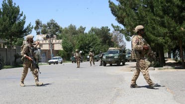  Afghanistan, security forces take position during a fighting outside a government compound in the city of Lashkar Gah, capital of Helmand province, Afghanistan, Wednesday, May. 13, 2015. Officials say gunmen have attacked a government compound in southern Afghanistan, killing three police and four civilians. (AP Photo/ Abdul Khaliq)