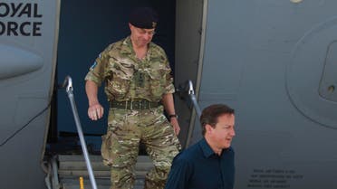 Britain's Prime Minister David Cameron, right, accompanied by General Sir David Richard, Chief of the Defence staff, ap