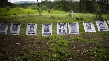 Portraits of disappeared people during the 1960-1996 internal conflict hang in La Verbena cemetery, Guatemala City, Monday, June 21, 2010. (AP)