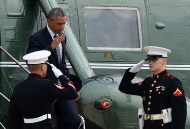 President Barack Obama returns a salute as he walks off of Marine One to head to Air Force One (AP)