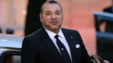 Morocco's King Mohammed VI poses as he leaves after a meeting (AP)