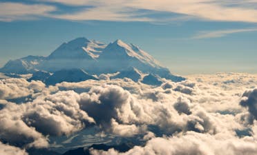 Mount McKinley seen piercing through the clouds above Denali National Park and Preserve in Alaska. (AP)