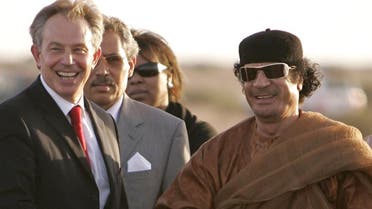 British Prime Minister Tony Blair, left, shakes hands with Libyan leader Muammar Qaddafi, right, following a two-hour meeting at the Colonel's headquarters in Sirte near Tripoli, 29 May 2007. (AP)