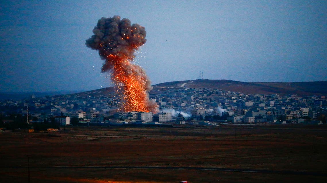 Smoke rises over Syrian town of Kobani after an airstrike, as seen from the Mursitpinar border crossing on the Turkish-Syrian border in the southeastern town of Suruc in Sanliurfa province, October 18, 2014. (Reuters)
