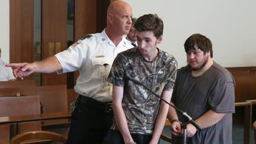 Kevin Norton and James Stumbo leave the courtroom following their dangerousness hearing at Boston Municipal Court, Tuesday, Sept. 1, 2015. (AP)