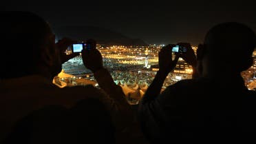 Muslim pilgrims takes pictures by their mobile to thousands of tents housing Muslim pilgrims are crowded together in Mina near Mecca. (File photo: AP)
