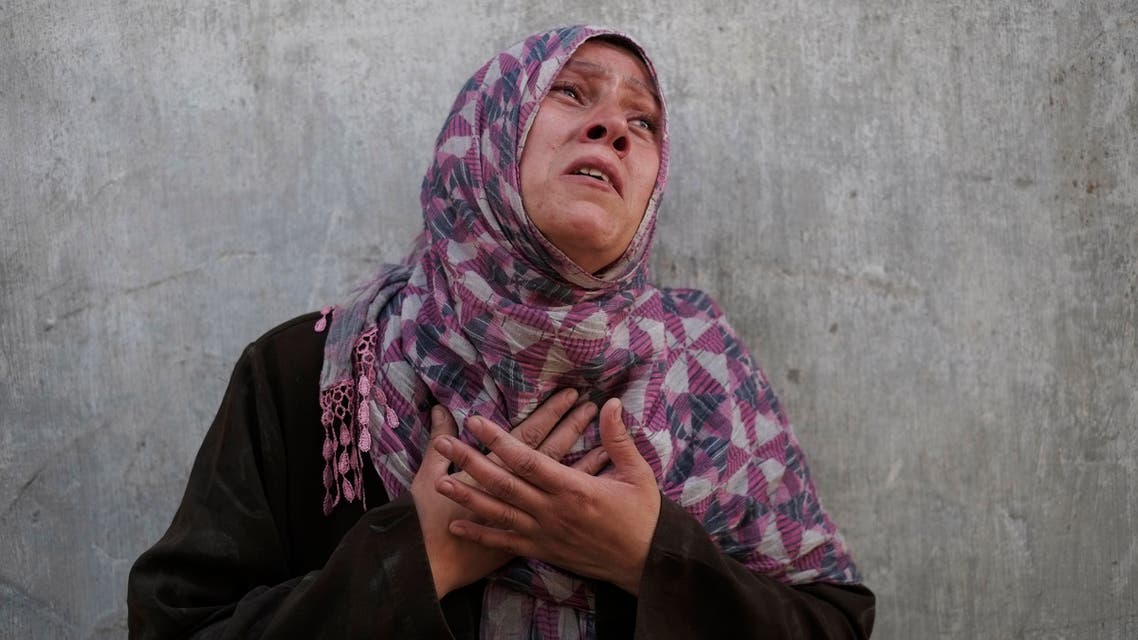 Palestinian Manal Keferna, 30, cries upon her return during a 12-hour cease-fire to the family house destroyed by Israeli strikes in Beit Hanoun, northern Gaza Strip, Saturday, July 26, 2014. (AP)