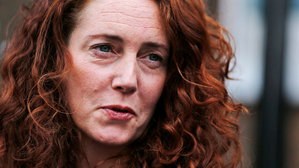 In this Thursday, June 26, 2014 file photo, Rebekah Brooks, former News International chief executive, talks to members of the media in central London. AP