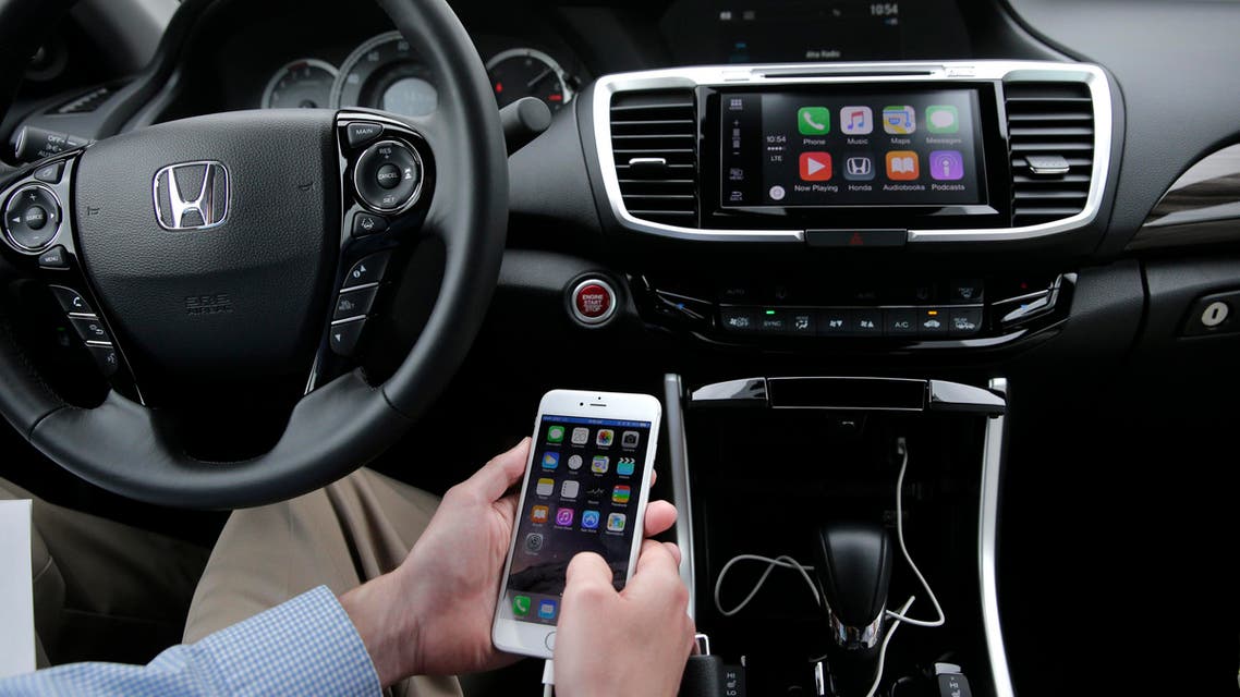 Chris Martin from Honda North America demonstrates Apple CarPlay. (AP)