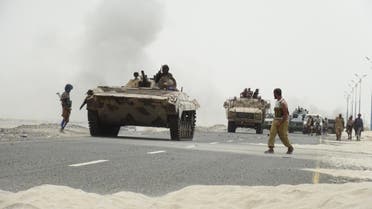 Southern Resistance fighters gather on a road leading to Yemen's Houthi-held southern province of Abyan. (Reuters)